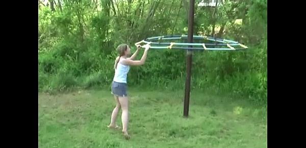  Young teen plays in the park and flashes her body